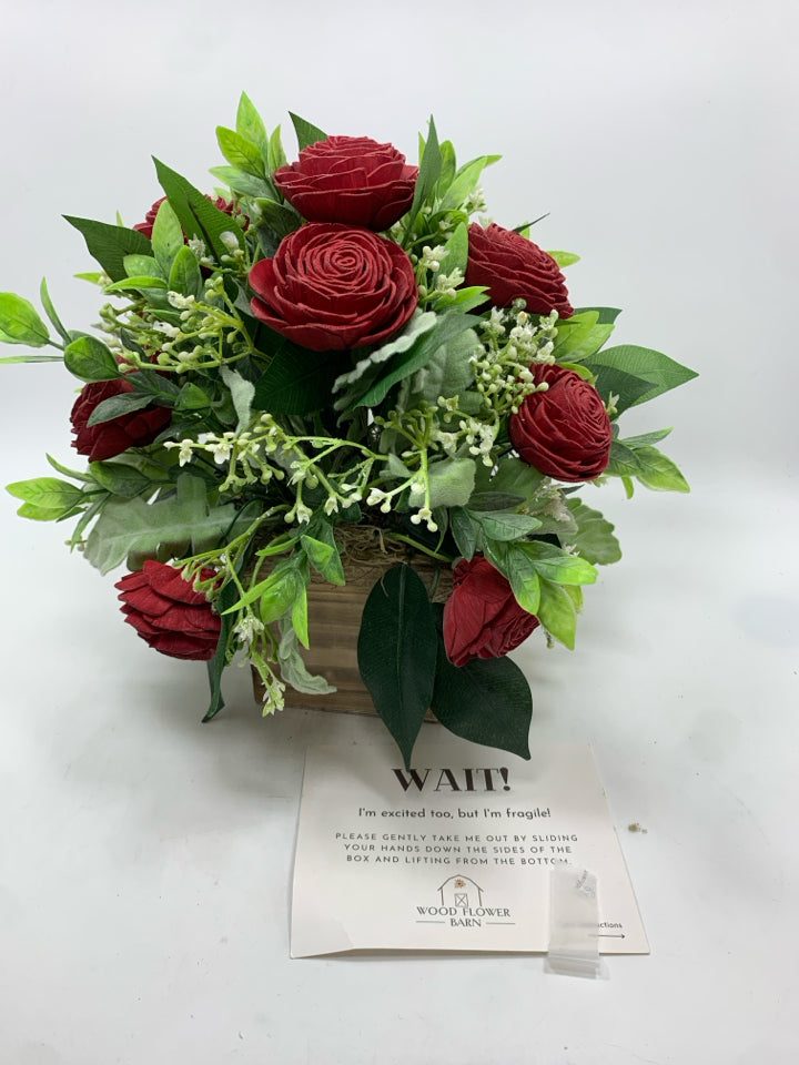 FAUX WOOD FLOWERS WITH TAG IN DISTRESSED WOOD POT.