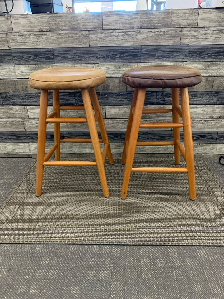 2 WOOD BAR STOOLS W FAUX LEATHER COVERS.