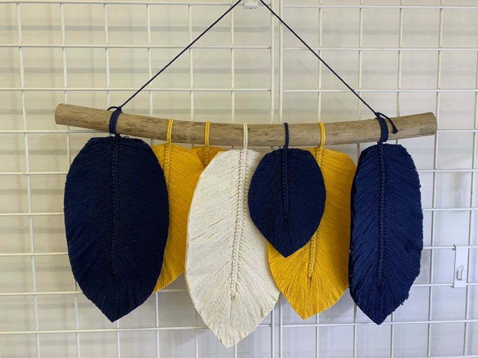 BLUE/YELLOW/WHITE HANGING FEATHERS ON STICK WALL ART.