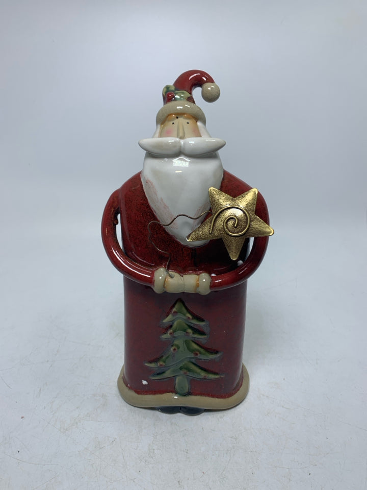 CERAMIC SANTA STANDING W/ HANDS TOGETHER HOLDING GOLD STAR.