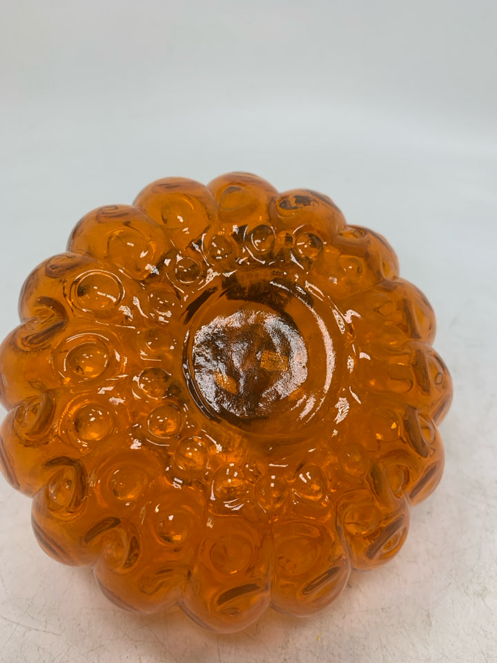 ORANGE GLASS PUMPKIN WITH BLACK STEM.
