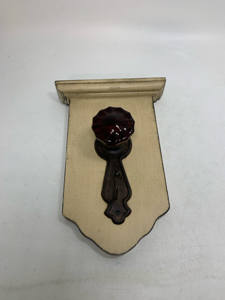 RUSTING DOOR KNOB HOOK WALL HANGING.