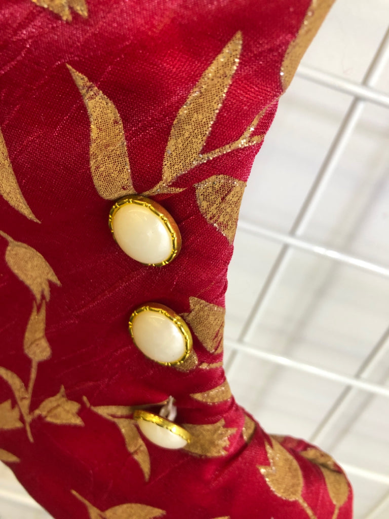 RED BOOT STOCKING W/FEATHERS.