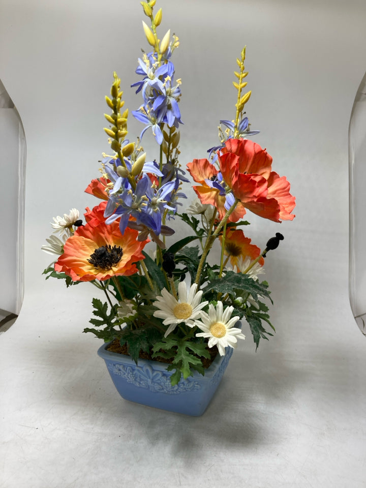 BLUE PLANTER W/ ASSORTED WILD FLOWERS.