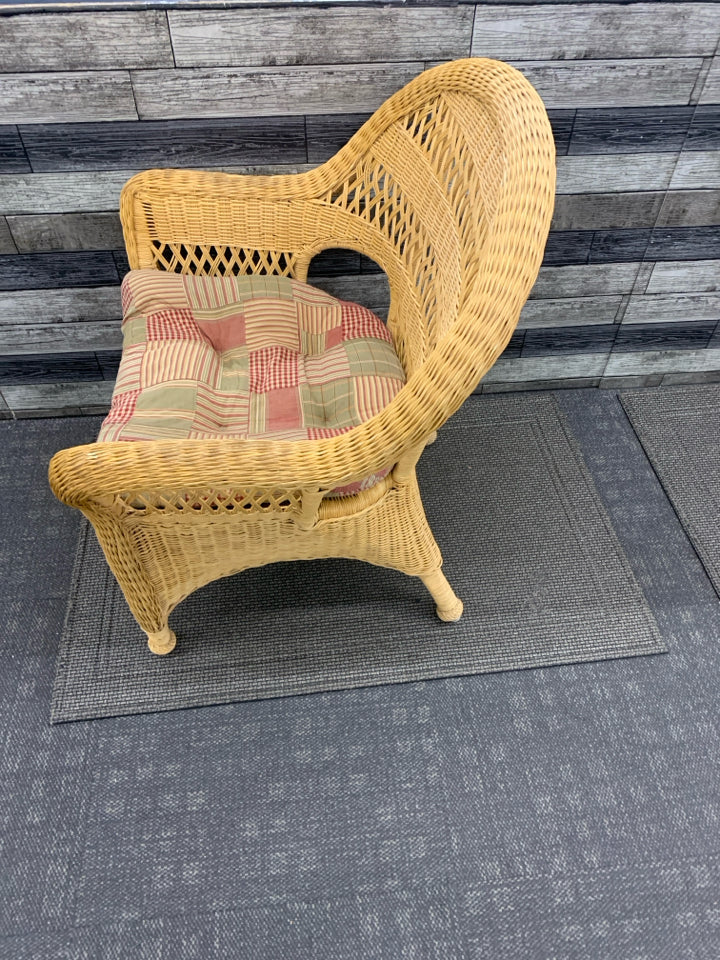 BLONDE WICKER CHAIR W/ PLAID CUSHION.