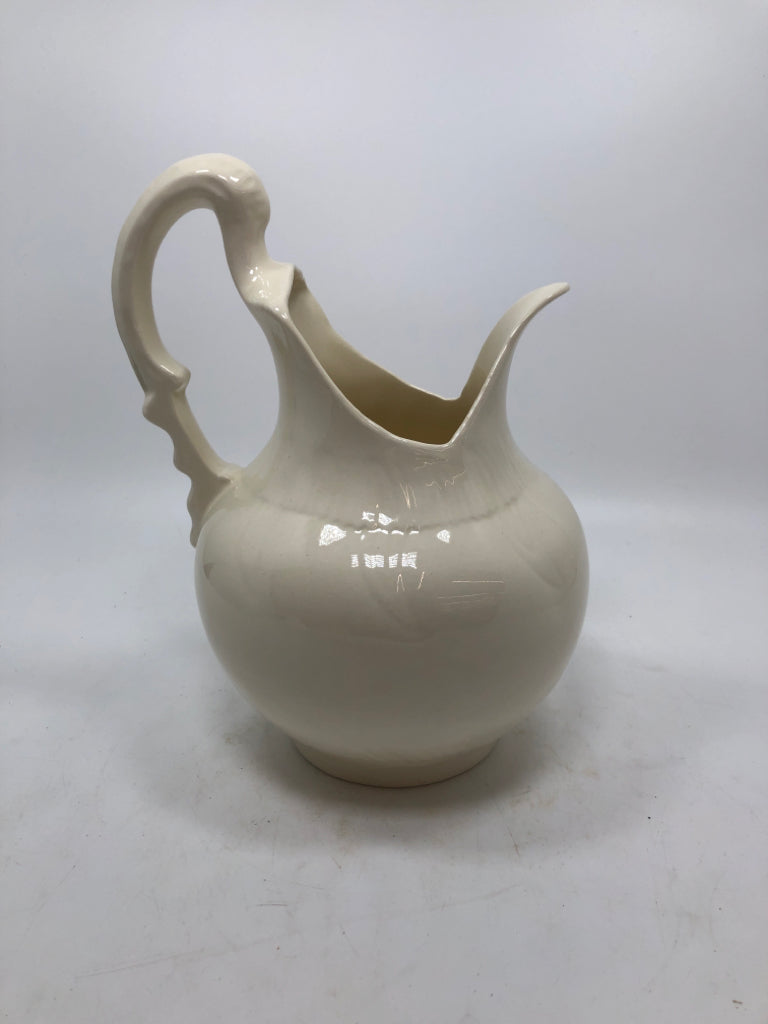 ABSTRACT CREAM COLORED PITCHER.