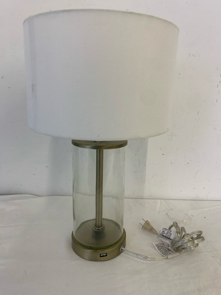 CLEAR GLASS BASE LAMP W WHITE SHADE.