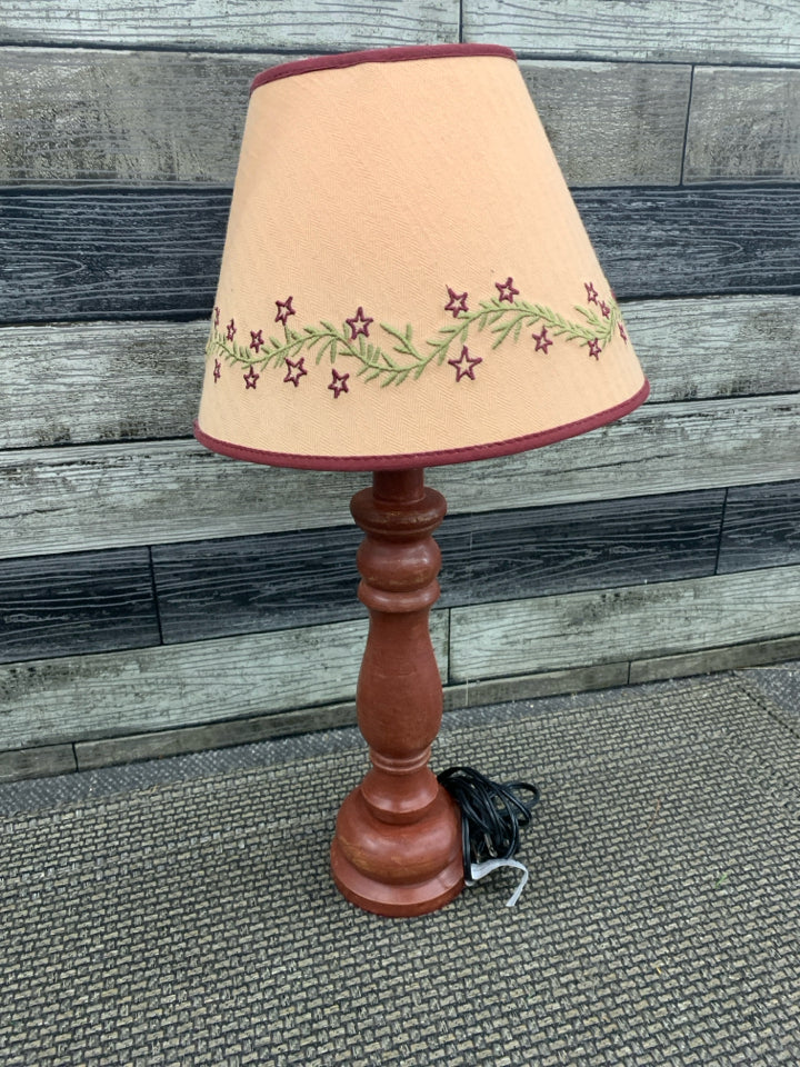 RED PRIMITIVE LAMP.