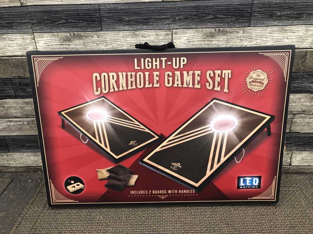 NIB LIGHT UP CORNHOLE GAME.