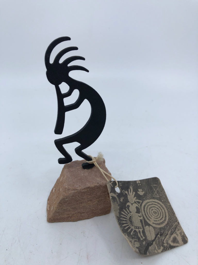 KOKOPELLI WITH FLUTE ON ROCK.