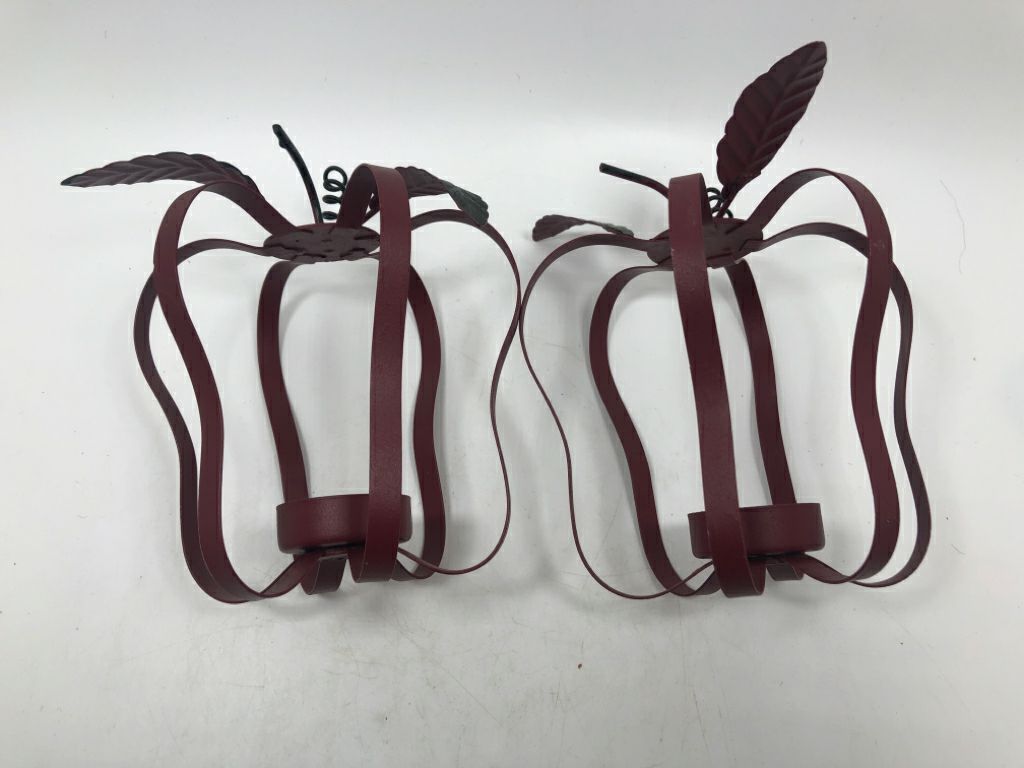 2 RED METAL APPLE VOTIVE CANDLE HOLDERS.