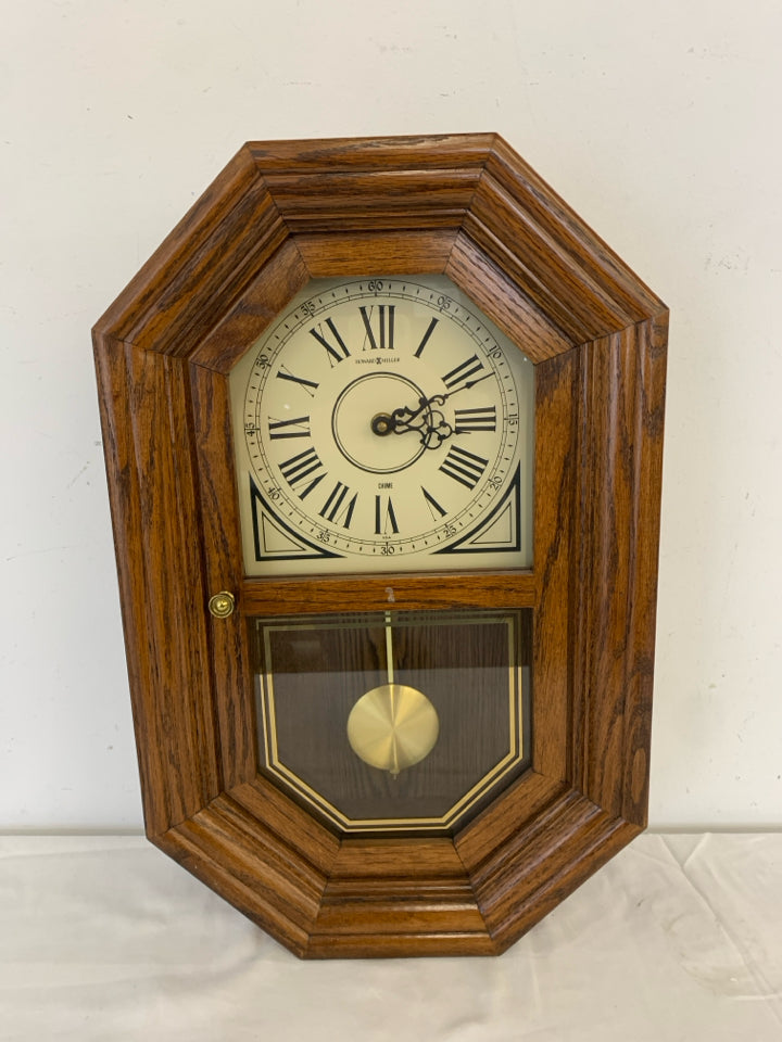 HOWARD MILLER WOOD HANGING CLOCK.