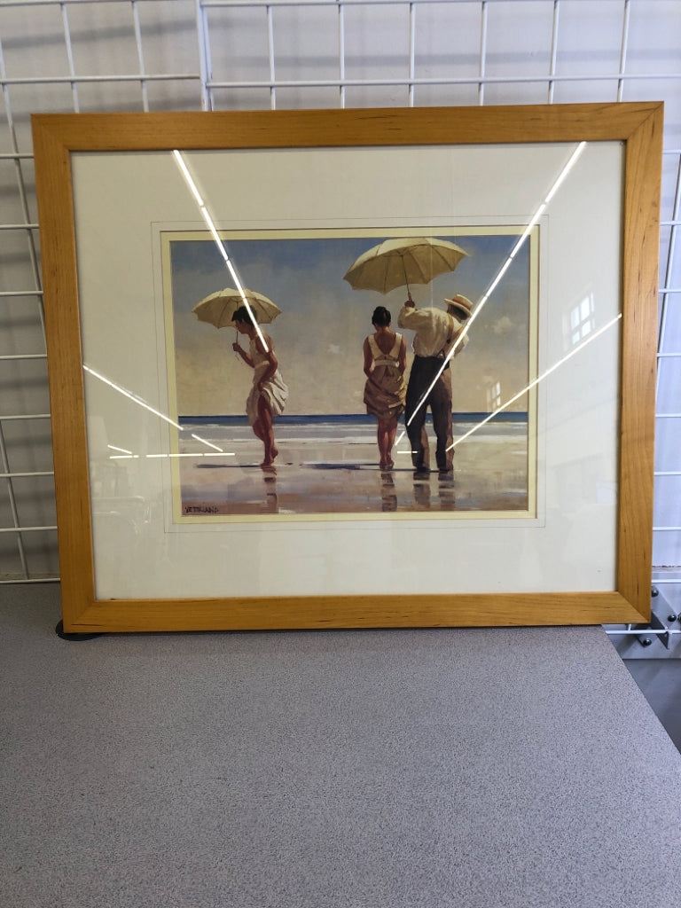 PEOPLE ON BEACH PAINTING IN LT BROWN WOOD FRAME.
