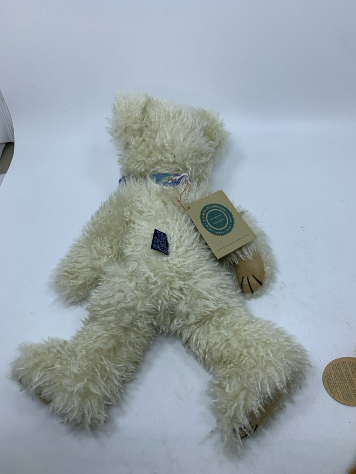 WHITE SHAG BEAR W/ FLORAL BOW.