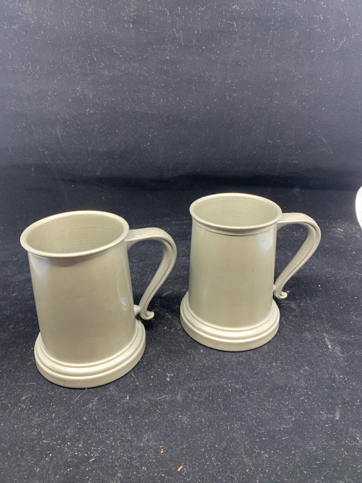 2 METAL BEER STEINS W SEE THROUGH BOTTOM.