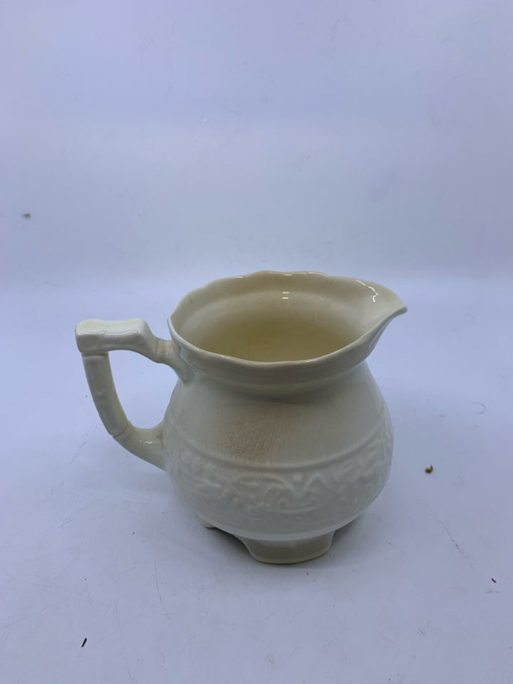 SMALL EMBOSSED PITCHER.