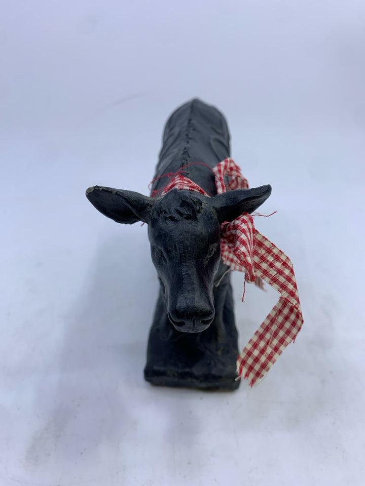 BLACK STANDING COW W/ SWIRL DESIGN.