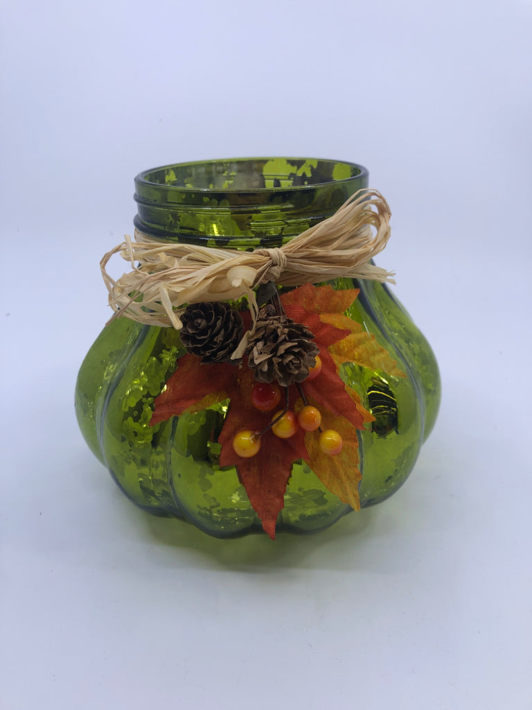 GREEN GLASS CANDLE HOLDER W/LEAVES AND BERRIES.