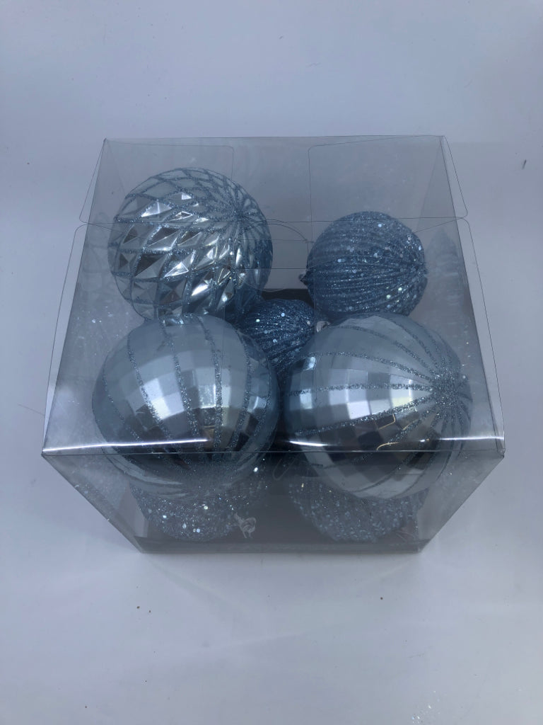 4 BLUE SPARKLE PLASTIC ORNAMENTS.