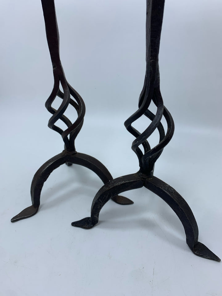 2 BROWN METAL PILLAR CANDLE HOLDERS.