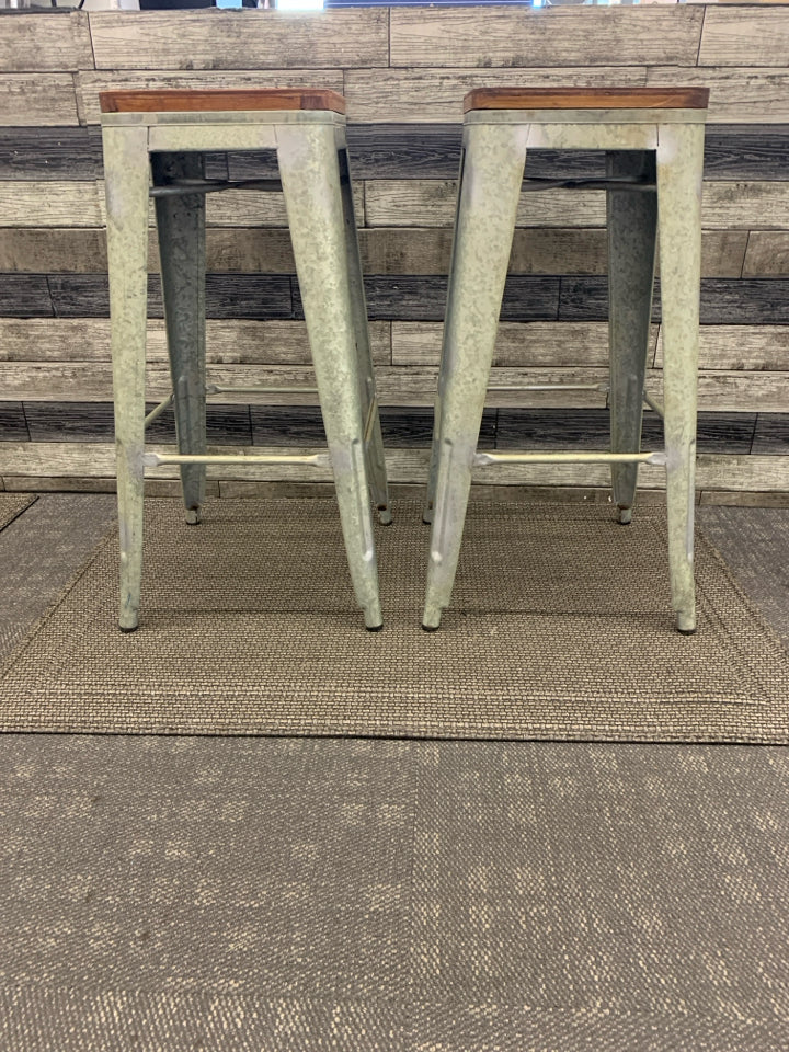 2 GALVANIZED WOOD TOP STOOLS.