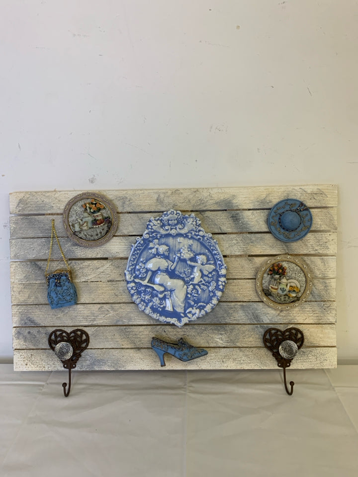 WOOD WALL HANGING W BLUE ACCENTS AND 2 HOOKS.