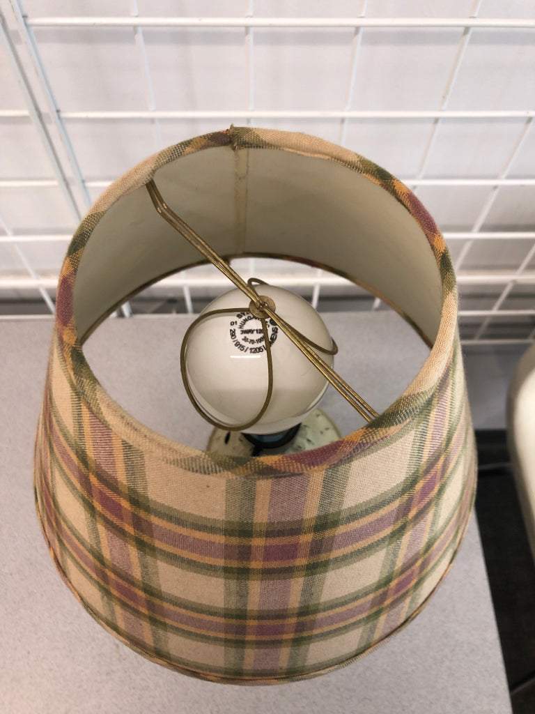 PUNCHED METAL PRIMITIVE LAMP W/PLAID SHADE.