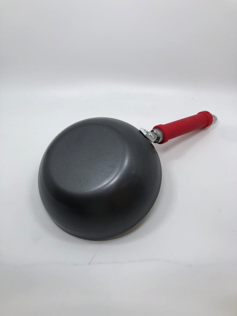 CARBON STEEL WOK W/RED RUBBER HANDLE.