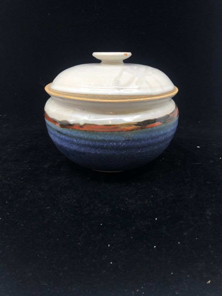 ROUND BLUE AND RED POTTERY CANISTER.