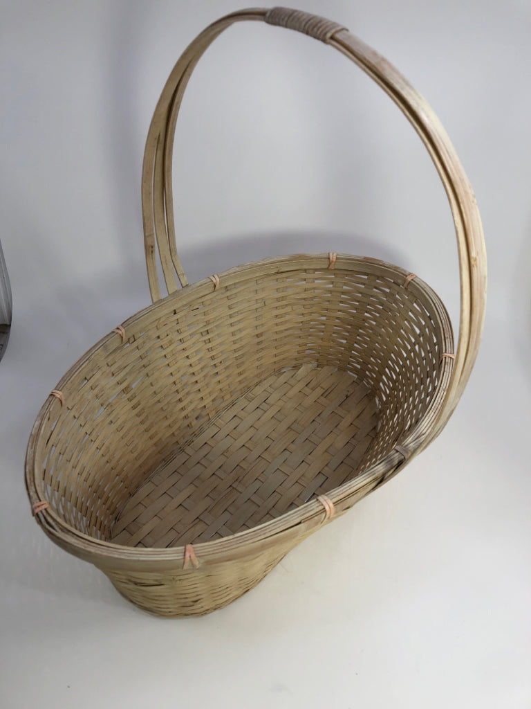WHITE OVAL WOODEN BRAIDED BASKET W/WRAPPED HANDLE.
