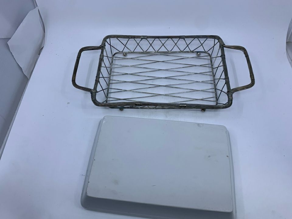 WHITE RECTANGLE SERVER IN SILVER METAL TRAY.