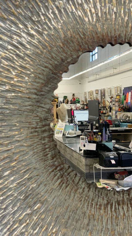 LARGE ROUND METAL MIRROR.