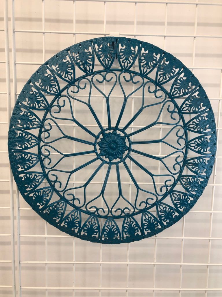 ROUND TEAL METAL WALL DECOR.