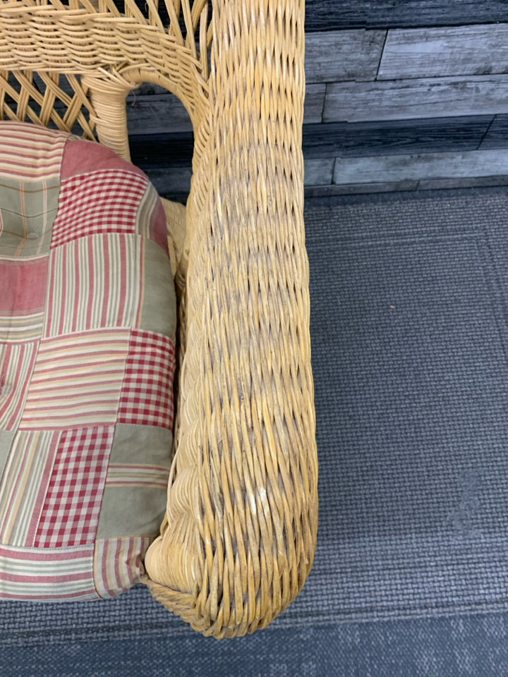 BLONDE WICKER CHAIR W/ PLAID CUSHION.