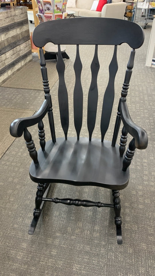 BLACK PAINTED WOOD ROCKING CHAIR.