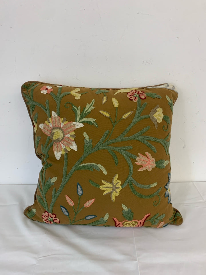 BROWN EMBROIDERED FLORAL PILLOW.