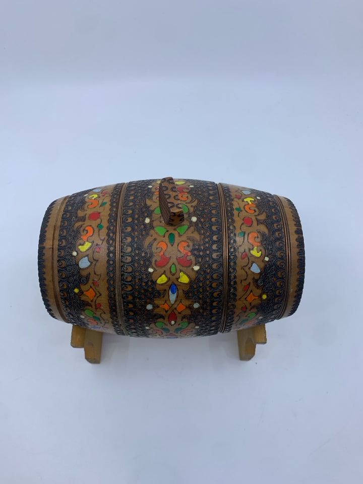 DECORATIVE CARVED/MULTI COLORED WOOD BARREL ON STAND.