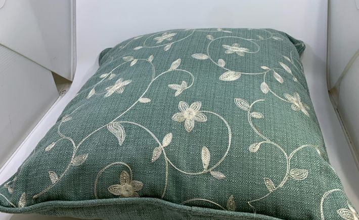 BLUE EMBROIDERED FLOWER PILLOW.
