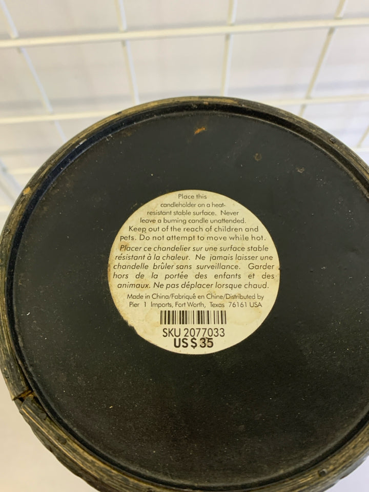 WOVEN RATTAN CANDLE HOLDER.