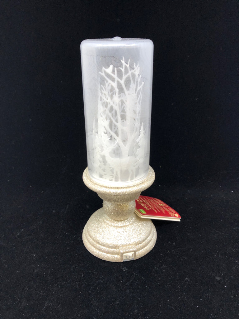 LIGHT UP FAUX CANDLE W DEER/WOOD SCENE.