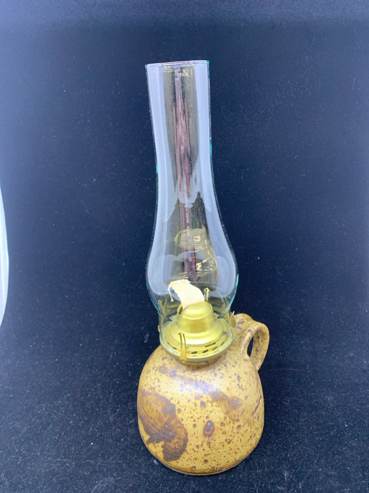 TAN W/ BROWN SPECKLES POTTERY BASE OIL LAMP W/ GLASS SHADE.