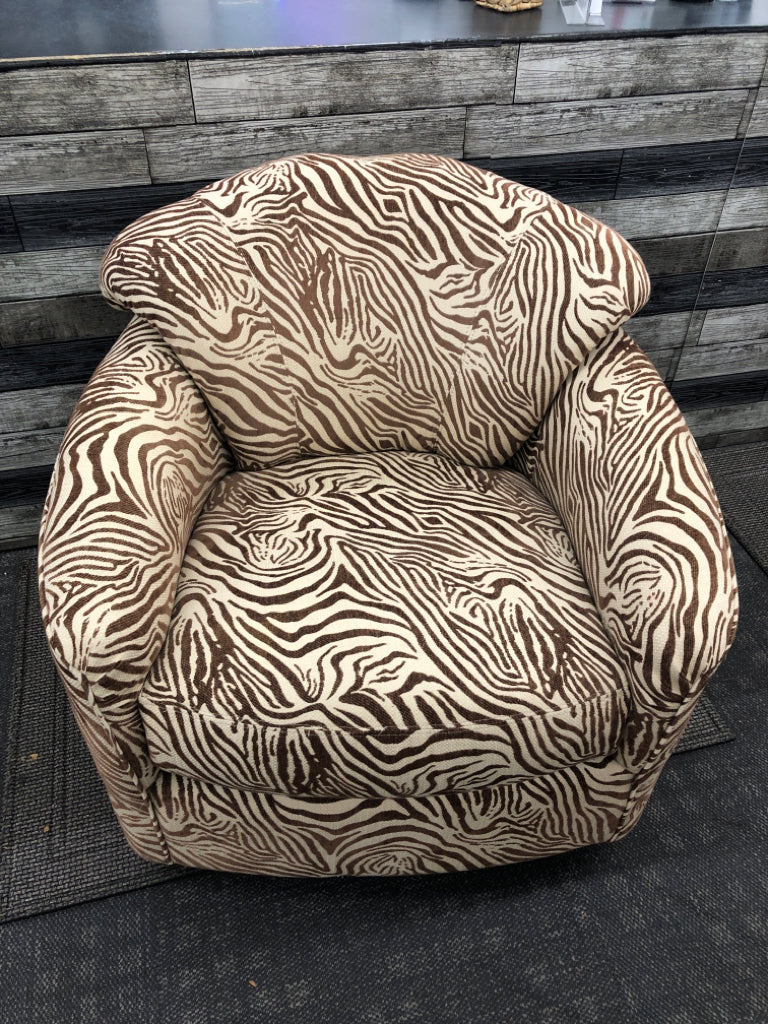 BROWN ZEBRA SWIVEL CHAIR.