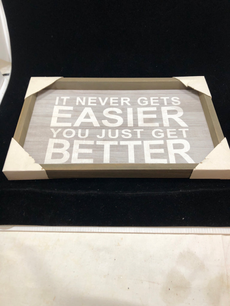 NEW IT NEVER GETS EASIER WALL HANGING.