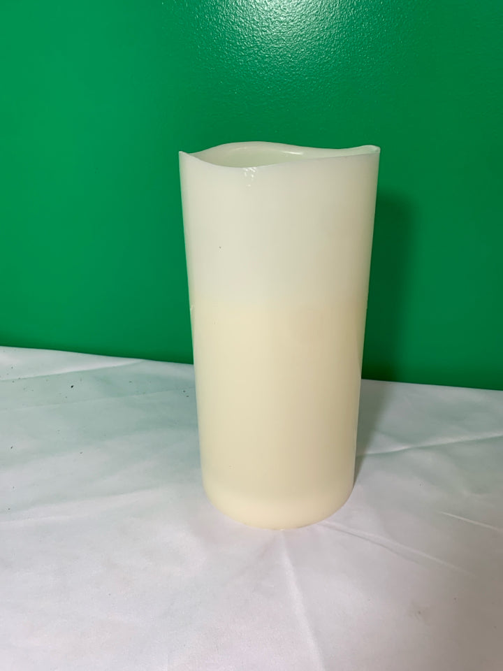 TALL WHITE BATTERY OPERATED CANDLE.