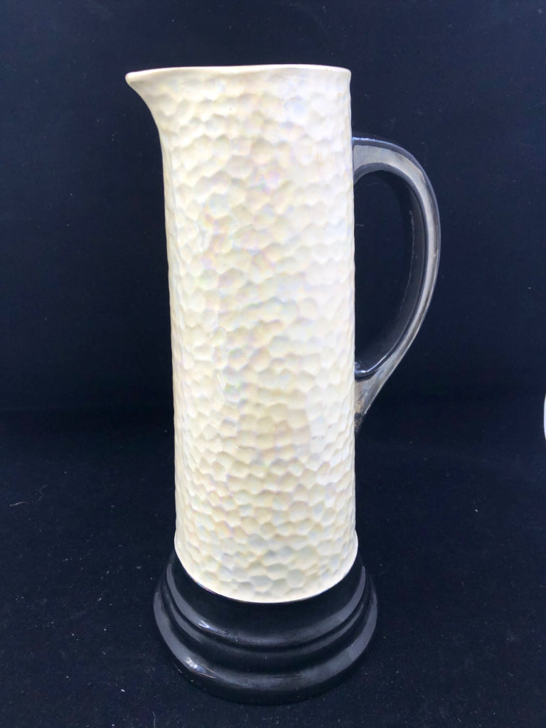 CREAM AND BLACK VASE W/MOTHER OF PEARL FINISH.