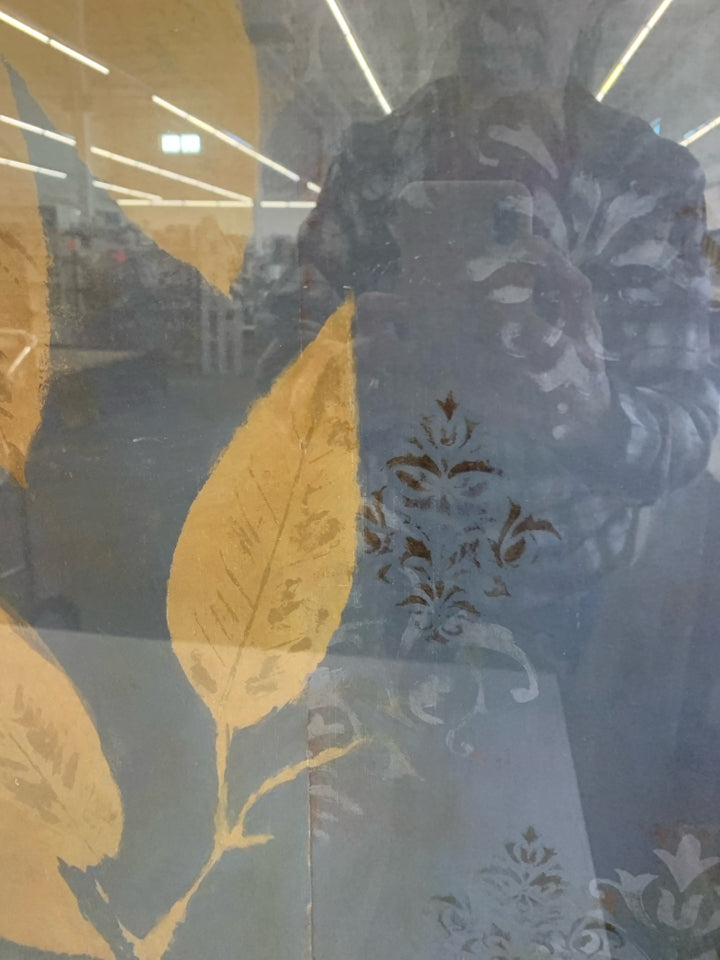 FRAMED LANIE LORETH BLUE & GOLD FLORAL ARTWORK.