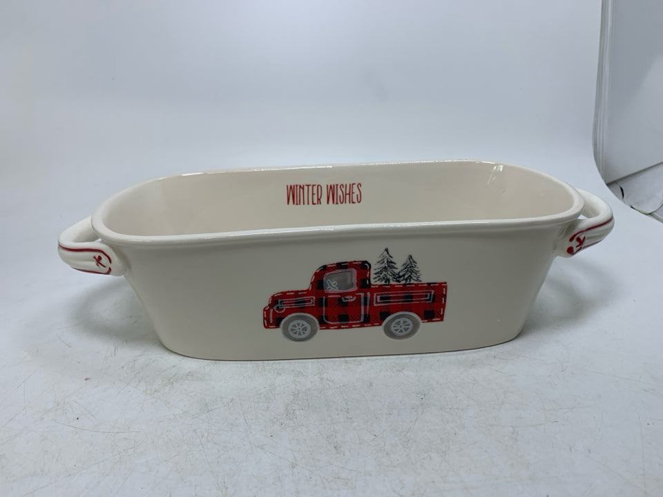 CREAM COLORED OVAL PLANTER W/ PLAID RED TRUCK.