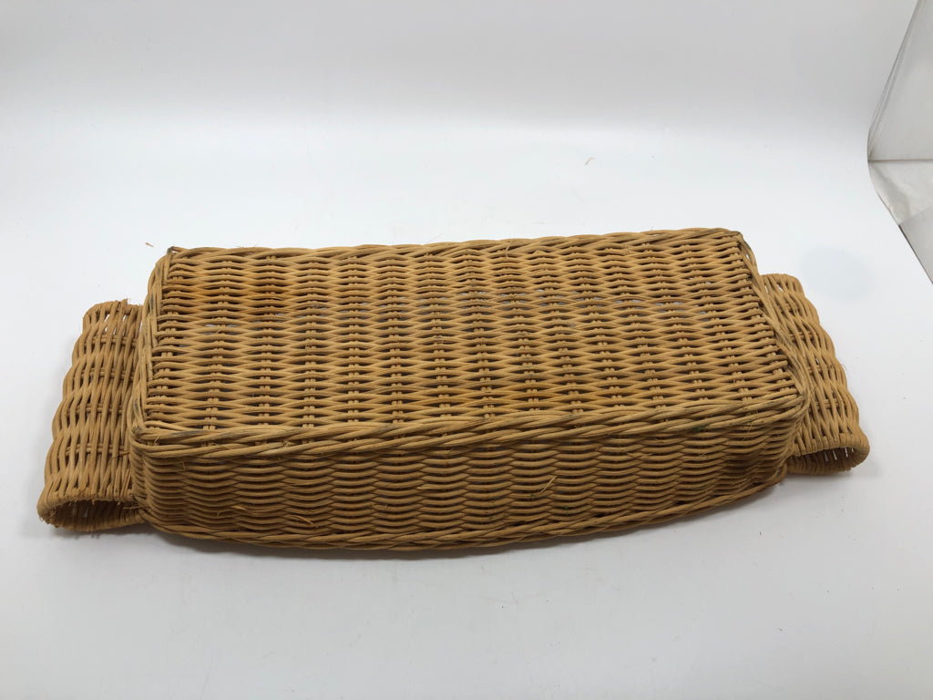 RECTANGULAR WICKER BASKET W FOLDED HANDLES.