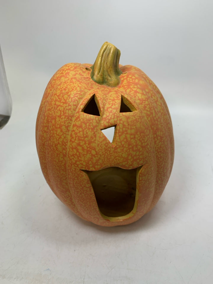 SPECKLED CERAMIC JACKO LANTERN CUTOUT CANDLE HOLDER.