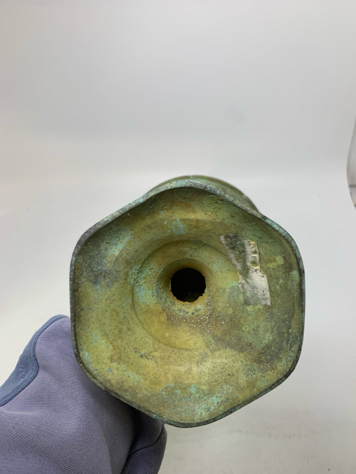 DISTRESSED FOOTED GREEN METAL VASE.